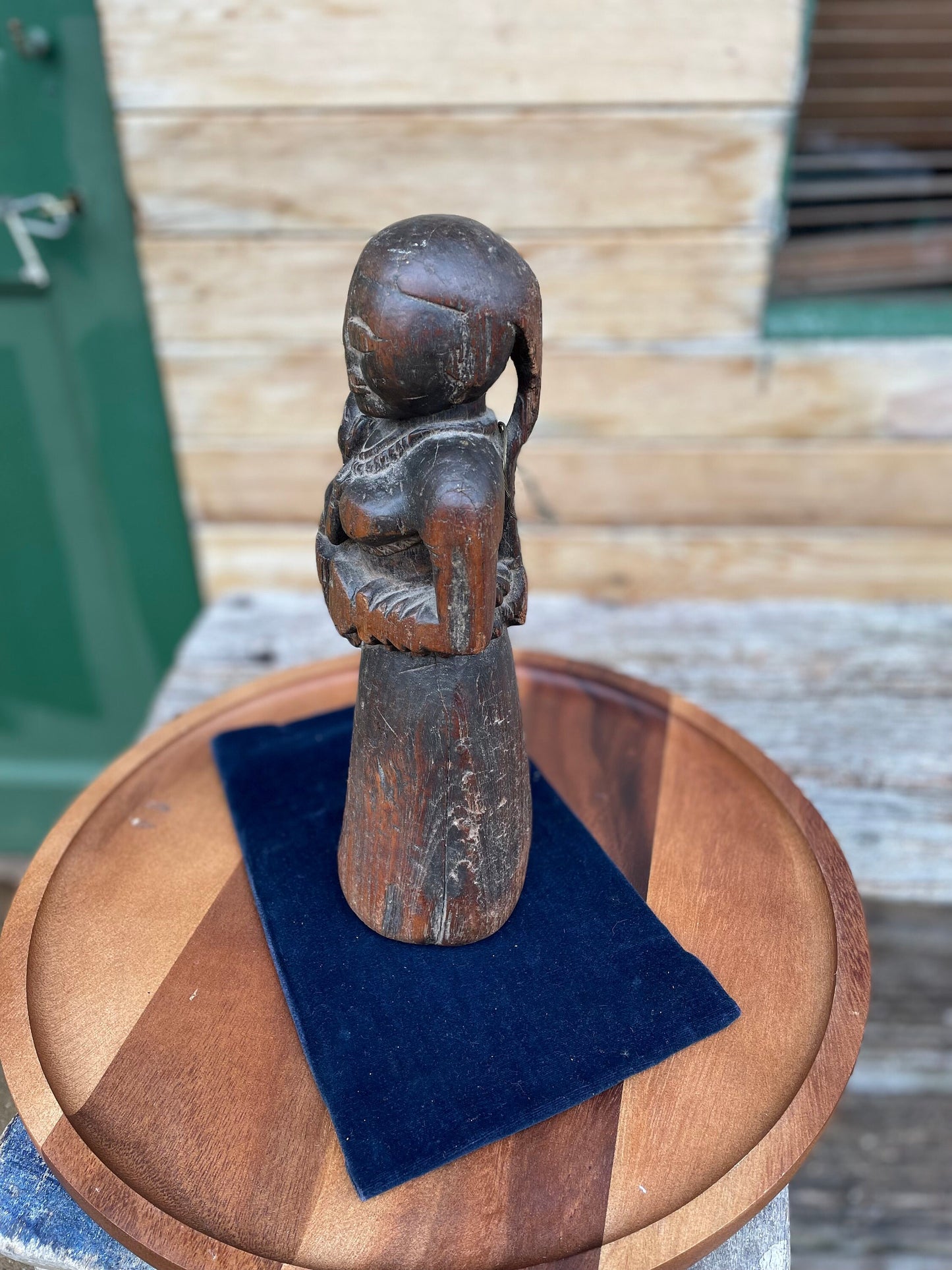 A Hand Carved Folk Art Figure of a mother and child, 29.5cm high