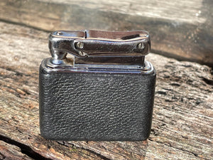 A vintage Colibri fuel lighter with faux leather base cap  4.5cm wide
