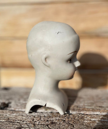 A Vintage Bisque Ceramic Dolls Head 23.5cm Tall