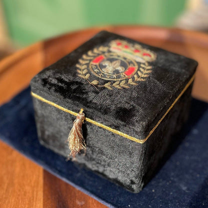 A black velvet jewellery casket with the French royalty emblem embroidered on the top 8cm tall