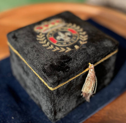 A black velvet jewellery casket with the French royalty emblem embroidered on the top 8cm tall