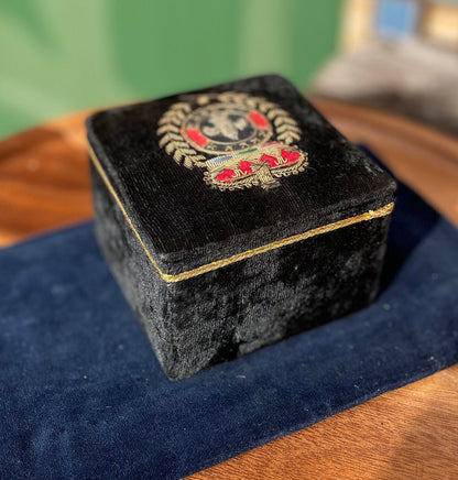 A black velvet jewellery casket with the French royalty emblem embroidered on the top 8cm tall