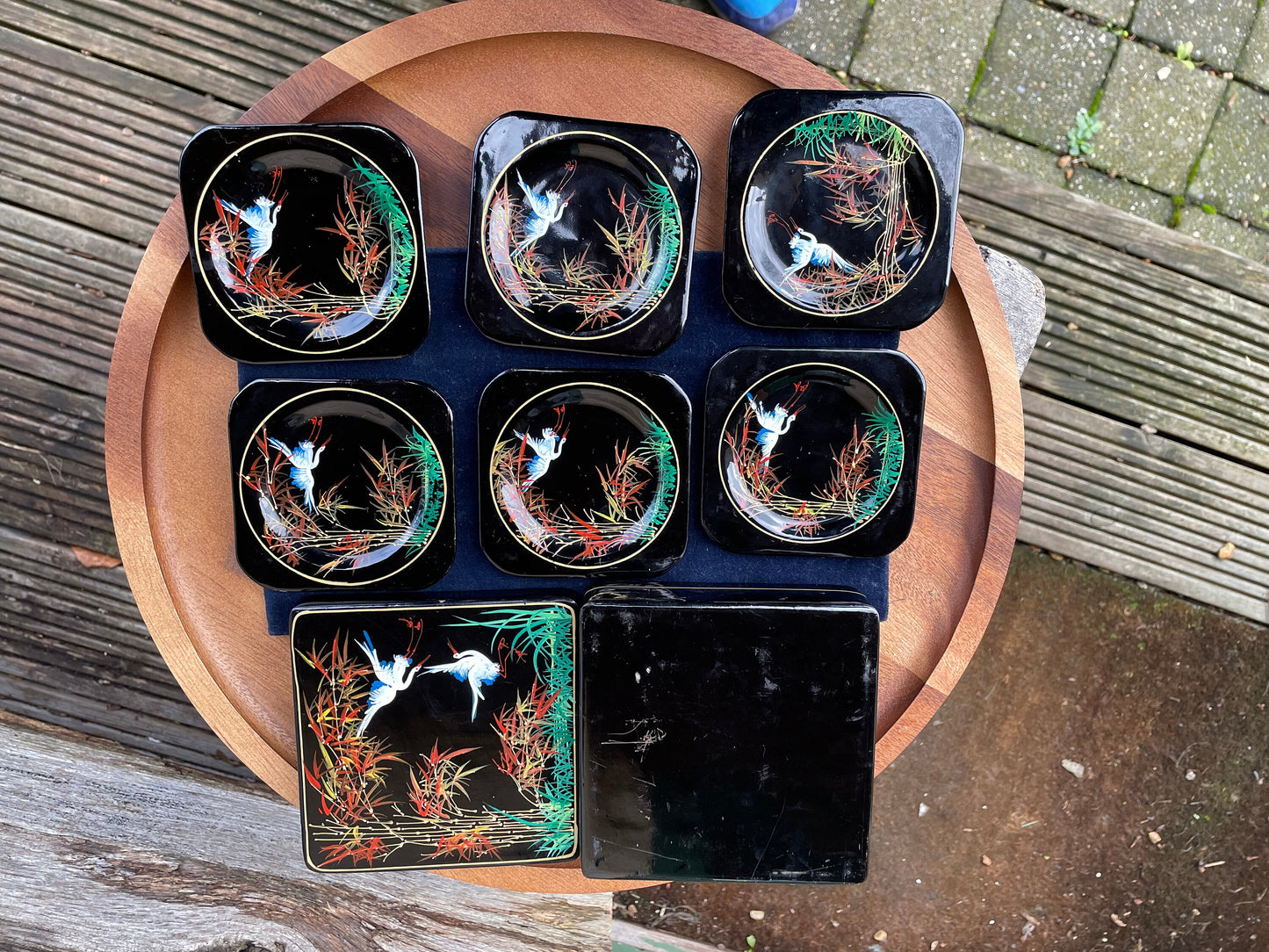 A set of six boxed Japanese lacquer coasters with hand painted egret and bamboo design 12x12cm box 1950's