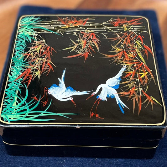 A set of six boxed Japanese lacquer coasters with hand painted egret and bamboo design 12x12cm box 1950's