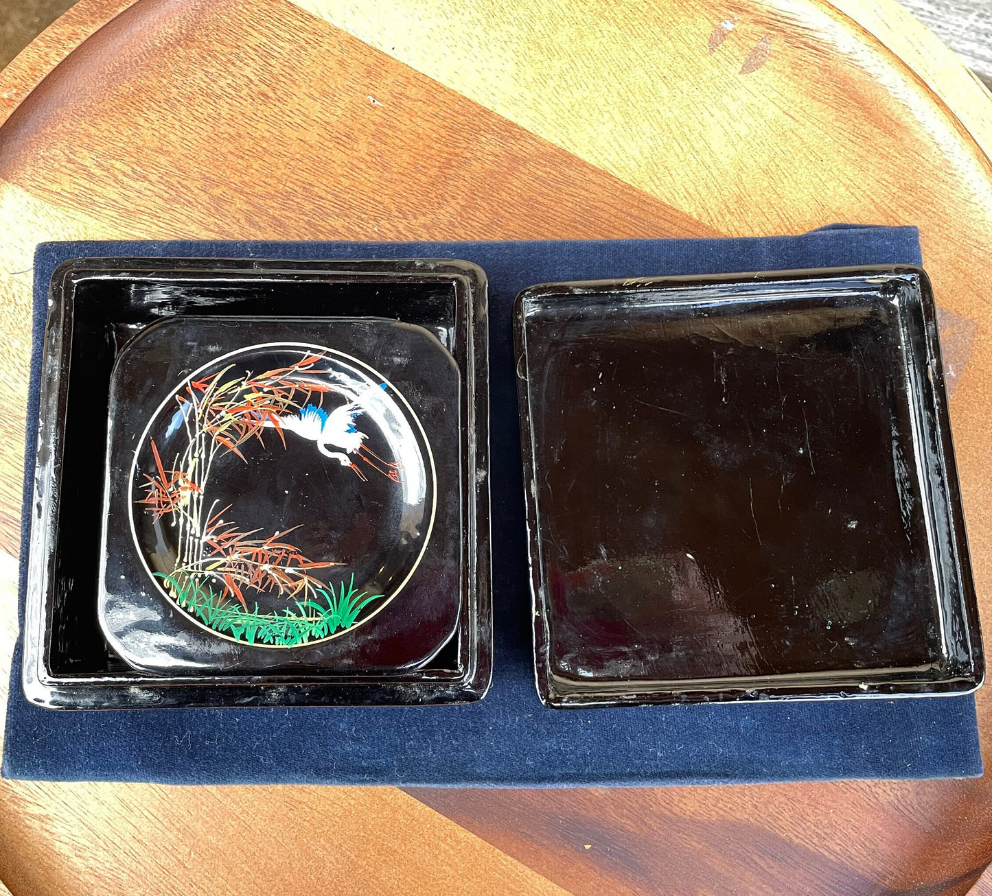 A set of six boxed Japanese lacquer coasters with hand painted egret and bamboo design 12x12cm box 1950's