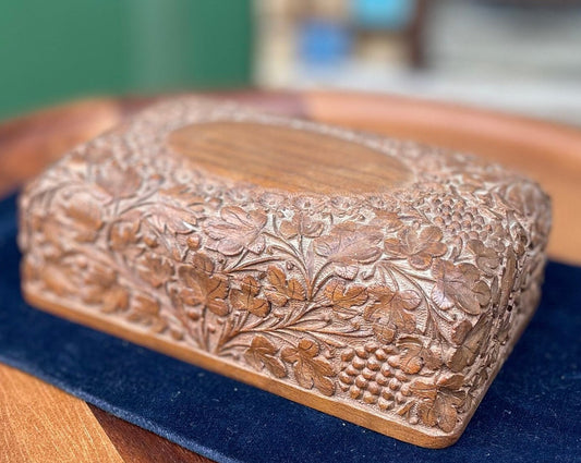 A vintage intricately hand carved wooden segmented Jewellery box 15.5cm wide