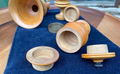 A collection of early 20th century antique turned wooden magic tricks