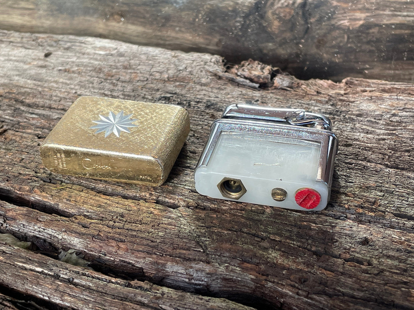 A vintage Colibri fuel lighter engraved with a star motif  4.5cm wide