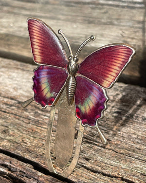 A vintage gold coloured enamel affect butterfly bookmark 6cm wide