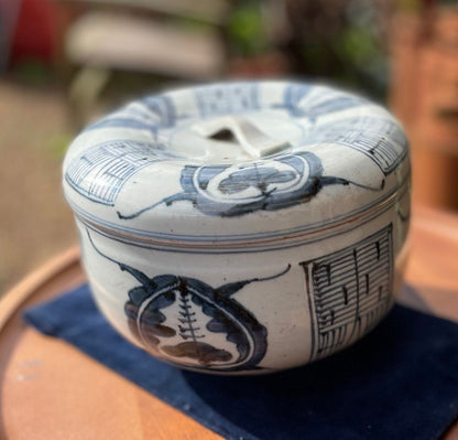 A large Japanese porcelain blue and white pot and cover 19cm diameter