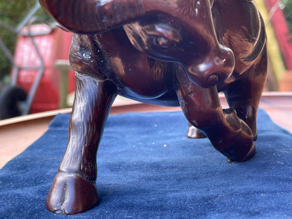 A Chinese ceramic figure of a water buffalo carrying a young monk/boy playing a flute 15cm tall