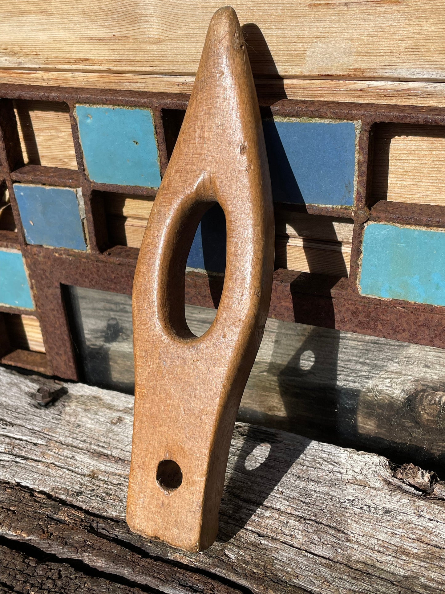 A vintage hand made wooden fishing net shuttle/needle tool piece of folk art 25cm long