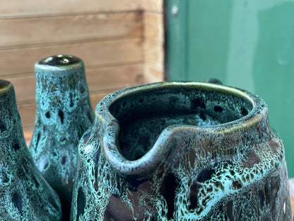 A Cornish  West Country English green honeycomb salt and pepper pot, vinegar pour and Jug set by Fosters Pottery