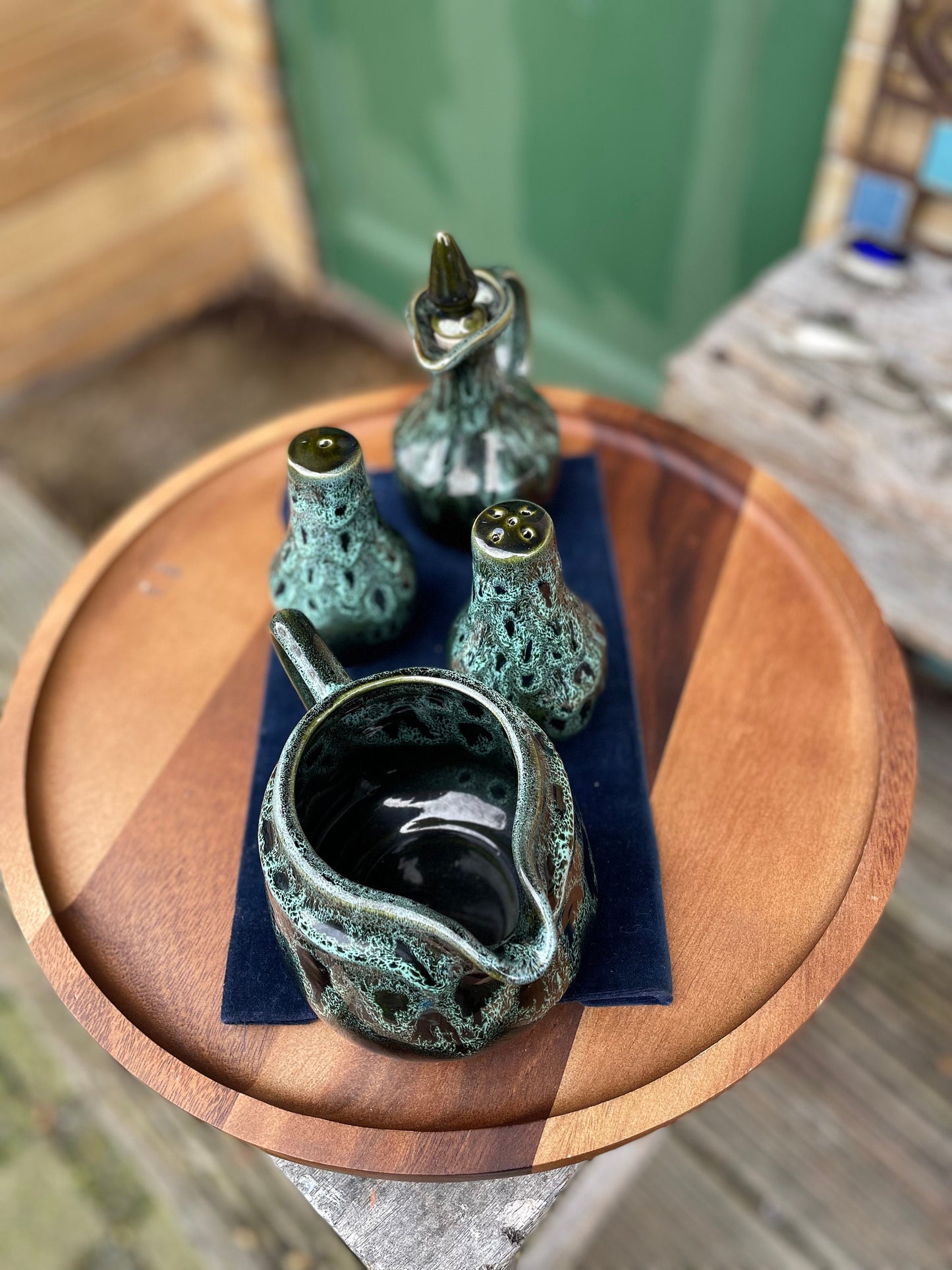 A Cornish  West Country English green honeycomb salt and pepper pot, vinegar pour and Jug set by Fosters Pottery