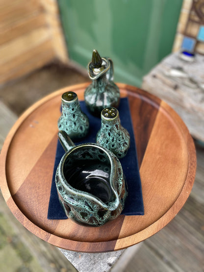 A Cornish  West Country English green honeycomb salt and pepper pot, vinegar pour and Jug set by Fosters Pottery