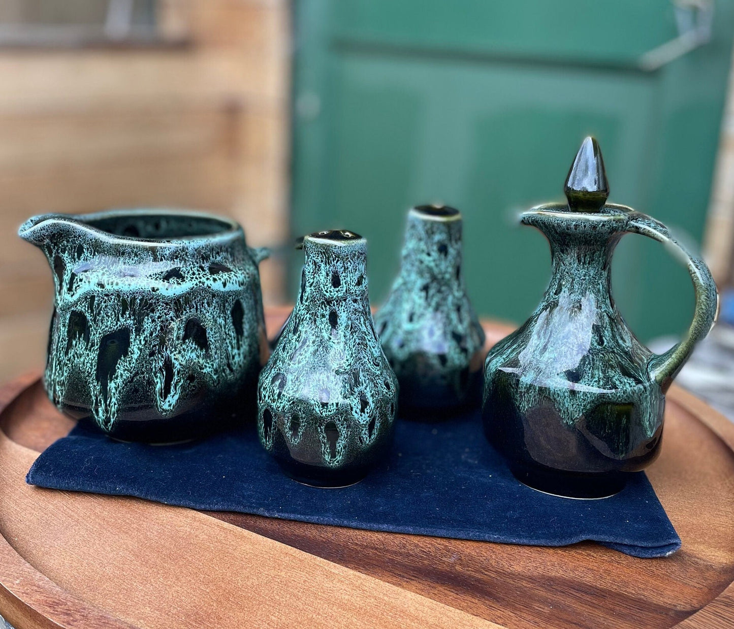 A Cornish  West Country English green honeycomb salt and pepper pot, vinegar pour and Jug set by Fosters Pottery