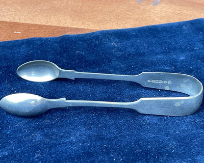 A  pair of silver plate sugar tongs by Pinder Bros 11.5cm long