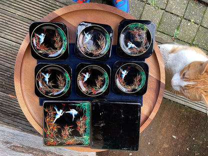 A set of six boxed Japanese lacquer coasters with hand painted egret and bamboo design 12x12cm box 1950's