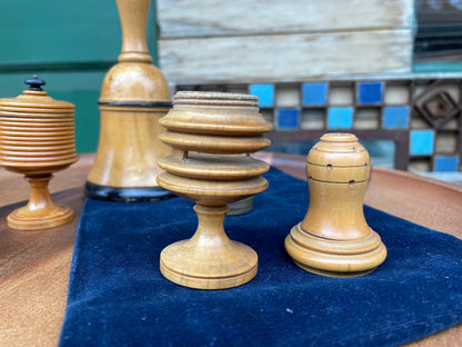 A collection of early 20th century antique turned wooden magic tricks