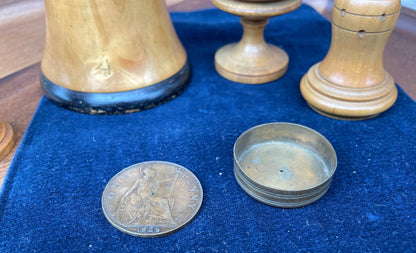 A collection of early 20th century antique turned wooden magic tricks