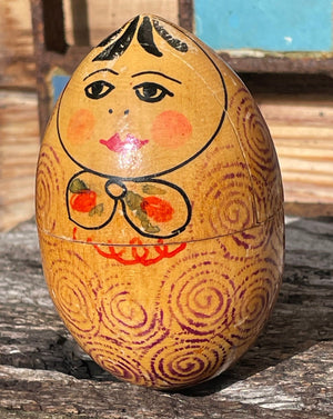 A vintage hand painted Russian wooden nest of dolls 7.5cm tall