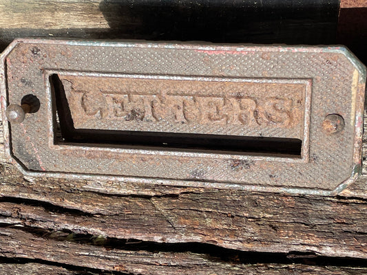 A heavy cast metal antique letter box fascia 19cm wide