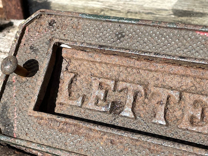 A heavy cast metal antique letter box fascia 19cm wide