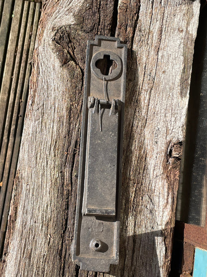 A heavy cast metal antique letter box and knocker combined fascia 31cm tall