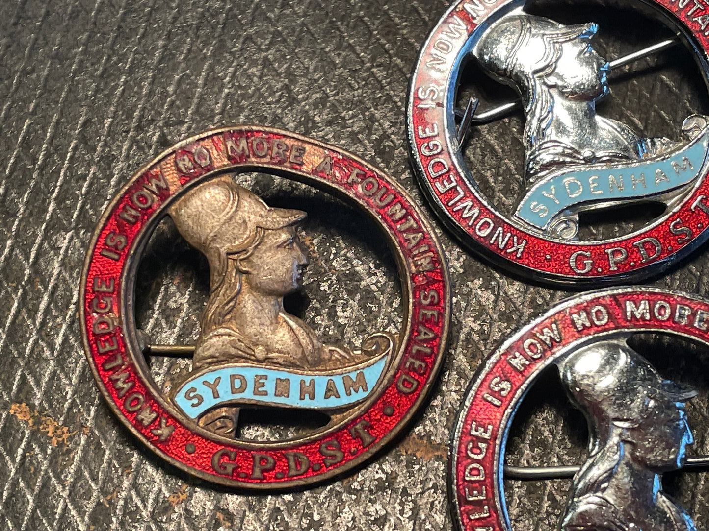 Three enamel badges from Sydenham High School in London with G.P.D.S.T- Sydenham ' on them 3.5cm diameter