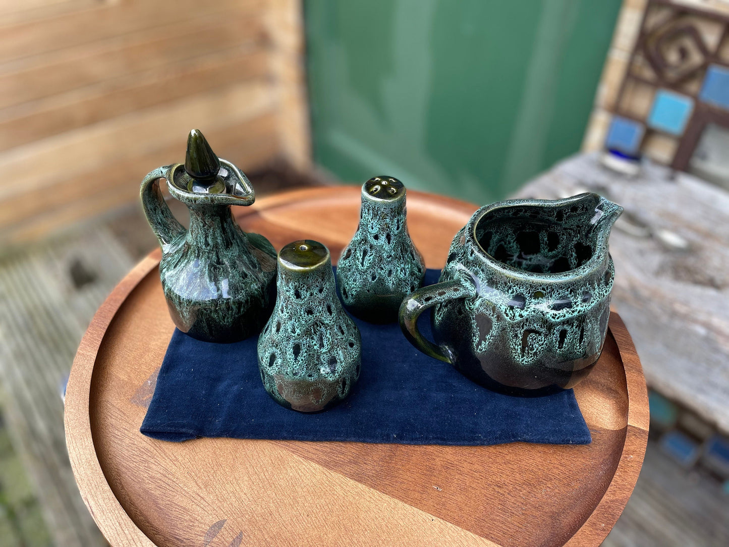 A Cornish  West Country English green honeycomb salt and pepper pot, vinegar pour and Jug set by Fosters Pottery