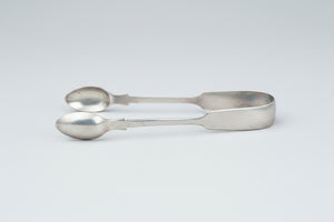 A  pair of silver plate sugar tongs by Pinder Bros 11.5cm long