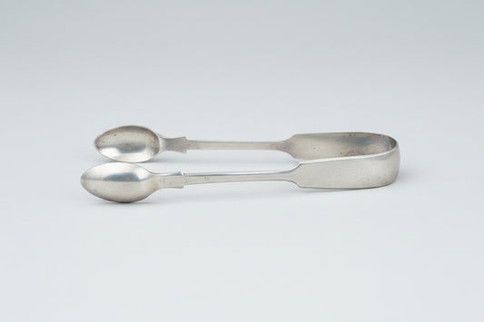 A  pair of silver plate sugar tongs by Pinder Bros 11.5cm long