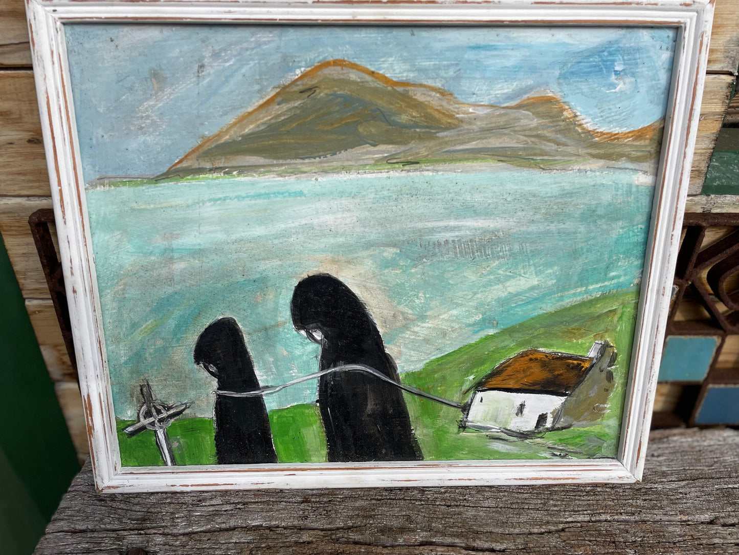 A contemporary original acrylic on board Folk Art painting, Irish School, monks on the foreshore, Co Mayo, unsigned and framed 29cm x 36cm