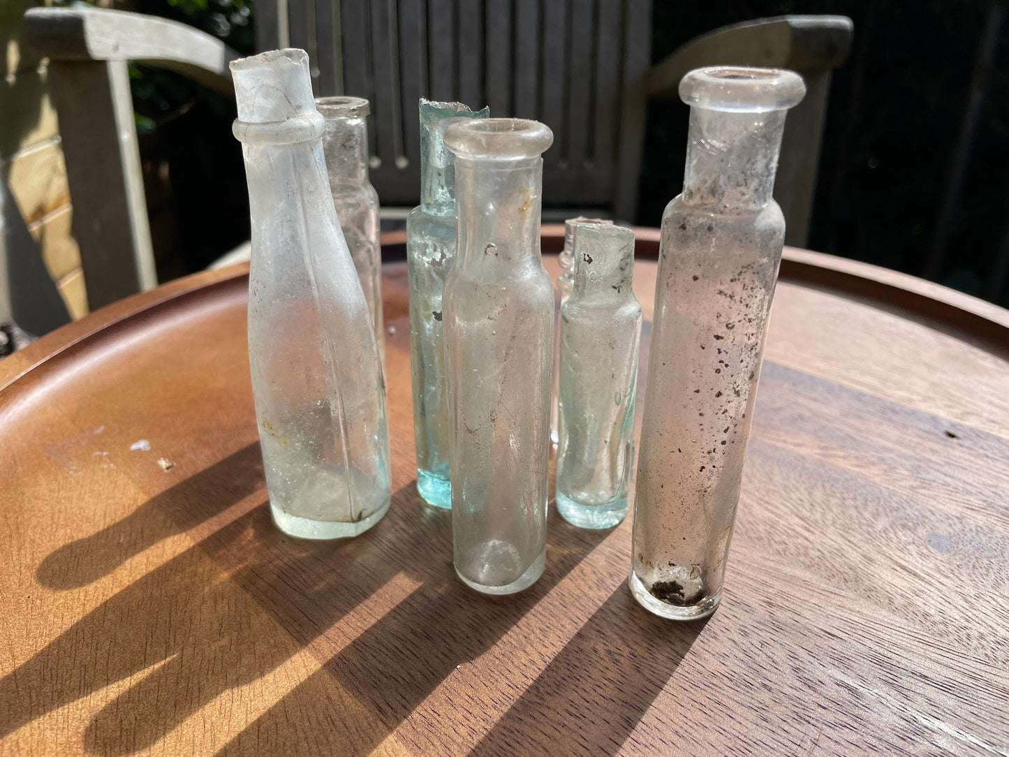 Seven Antique and vintage glass bottles tallest 15cm