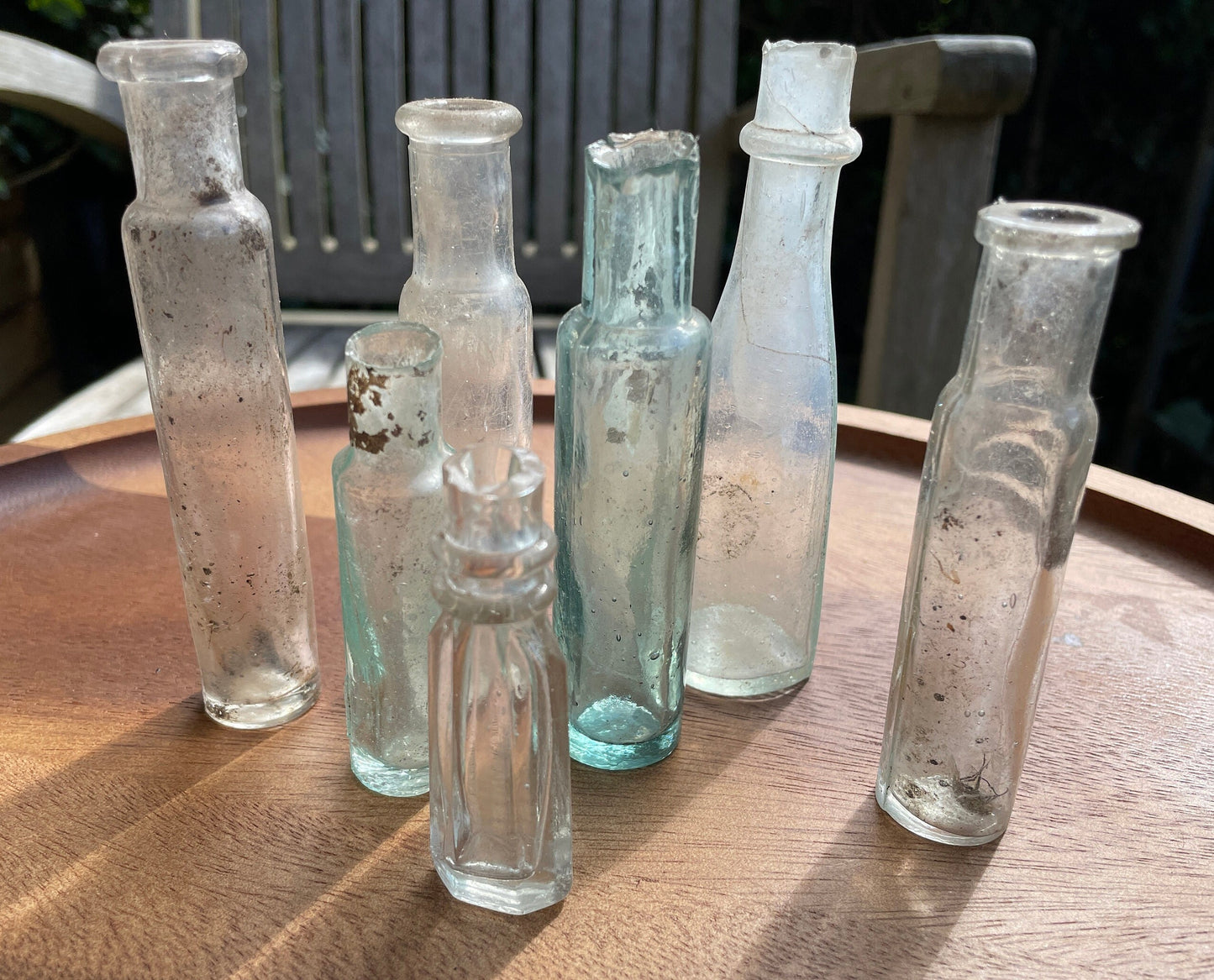 Seven Antique and vintage glass bottles tallest 15cm