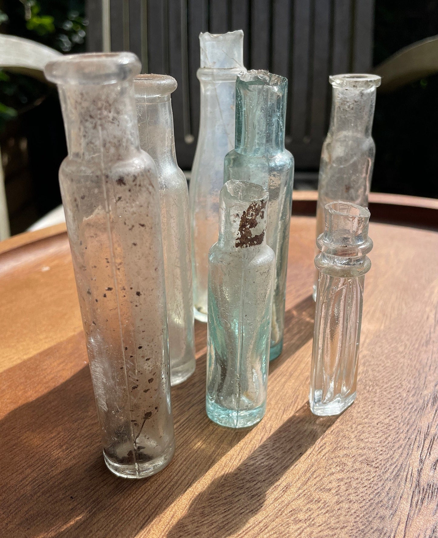 Seven Antique and vintage glass bottles tallest 15cm