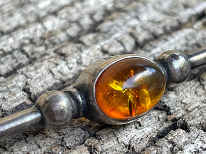 Unmarked silver and amber bar brooch 5cm long