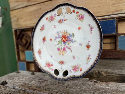 Porcelain gilded pierced dinner flower pattern plate marked 297 to rear 25cm diameter