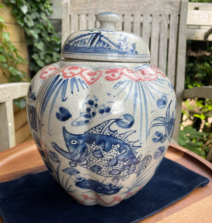 Chinese Yuan blue and white  crackle glazed jar and cover with fish design 23cm tall