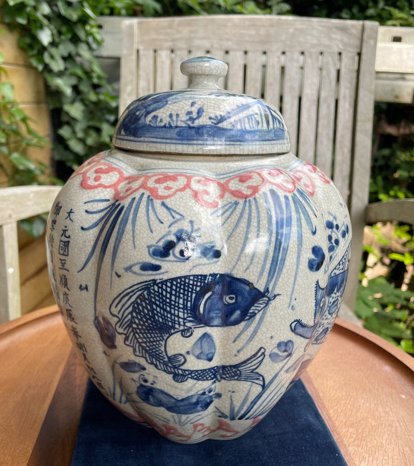 Chinese Yuan blue and white  crackle glazed jar and cover with fish design 23cm tall