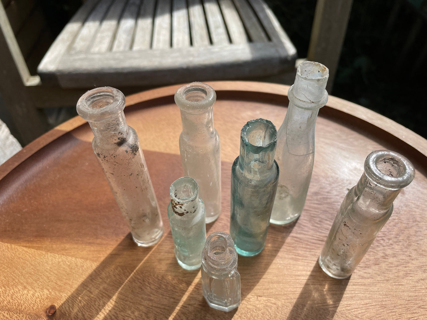 Seven Antique and vintage glass bottles tallest 15cm