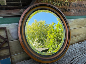 Circular bevelled edged wall mirror tarnished metal  surround/frame 31cm diameter