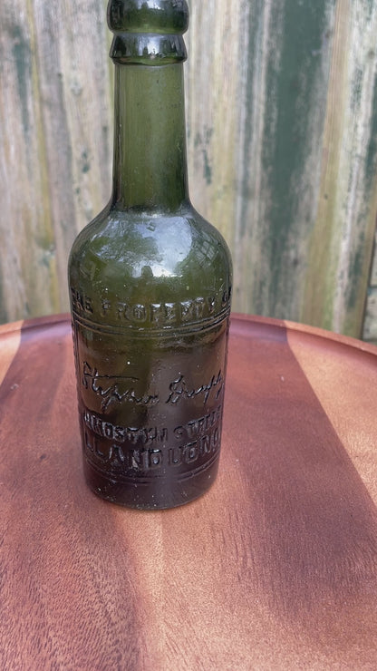 Antique green glass bottle Stephen Dunphy 111 Mostyn Street Llandudno North Wales c1900